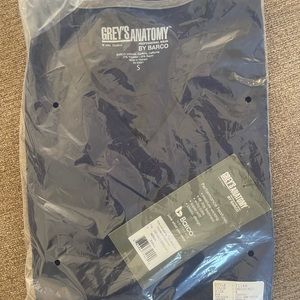 Brand New with tags Grey’s Anatomy scrub top. Size small, Navy (indigo)